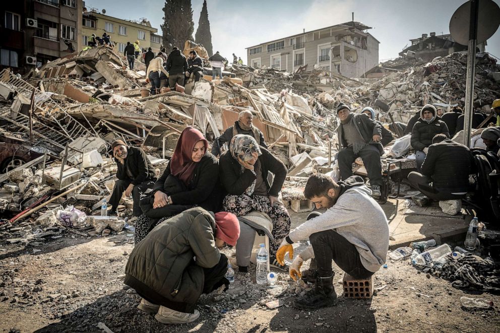 PHOTO: Displaced residents sit near their collapsed home as rescue operations continue in Antakya, Turkey, Feb. 9, 2023.