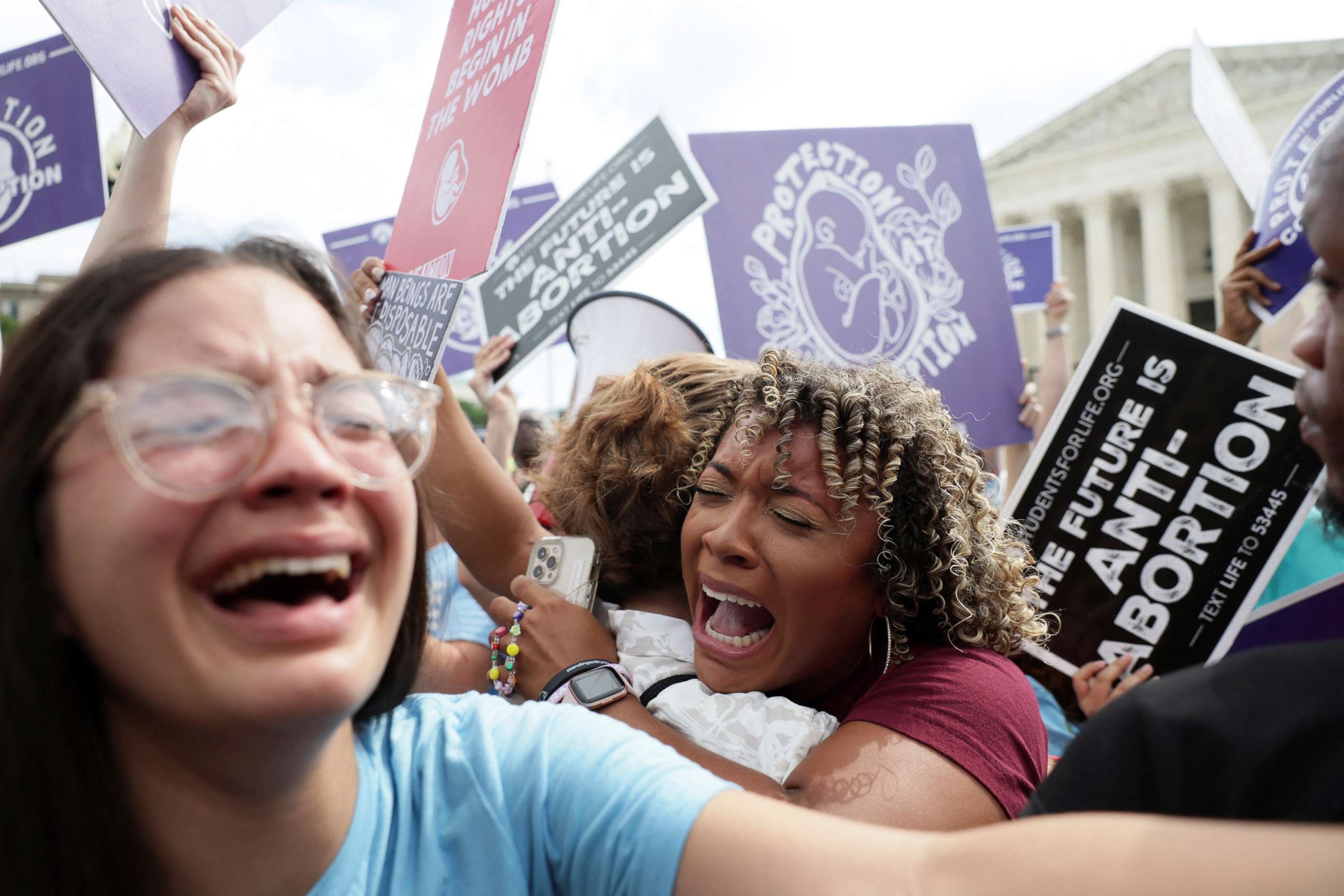 PHOTO:Anti-abortion demonstrators celebrate outside the U.S. Supreme Court as the court rules in the Dobbs v Women's Health Organization abortion case, overturning the landmark Roe v Wade abortion decision in Washington, June 24, 2022.