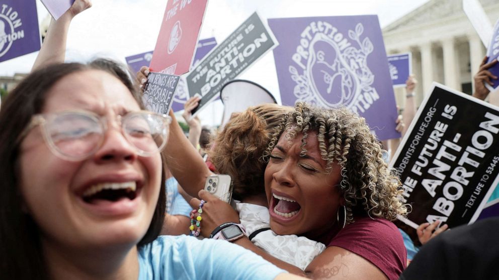 PHOTO:Anti-abortion demonstrators celebrate outside the U.S. Supreme Court as the court rules in the Dobbs v Women's Health Organization abortion case, overturning the landmark Roe v Wade abortion decision in Washington, June 24, 2022.