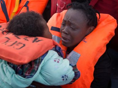 PHOTO: A mother holds her daughter after being rescued at sea off the coast of Libya, Feb. 3, 2017.