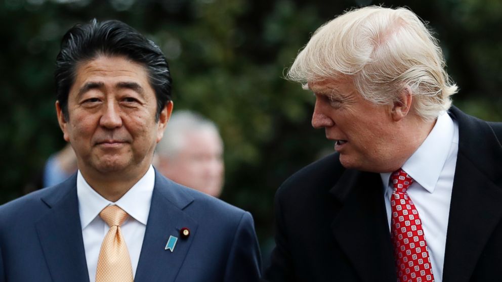 PHOTO: President Donald Trump talks to Japanese Prime Minister Shinzo Abe before boarding Marine One on the South Lawn of the White House in Washington, Feb. 10, 2017.