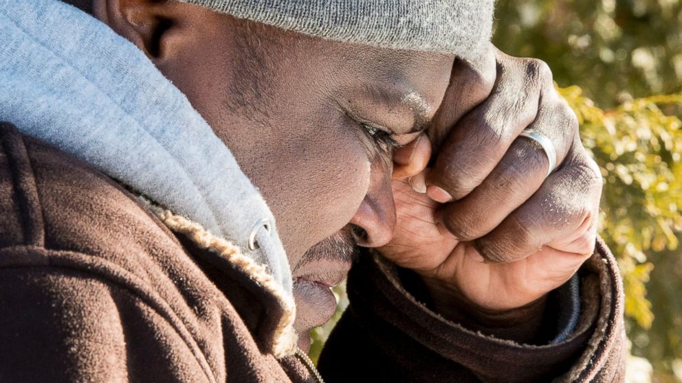 PHOTO: A Somali man wipes a tear after crossing the U.S.-Canada border into Canada near Hemmingford, Que., on Feb. 17, 2017.