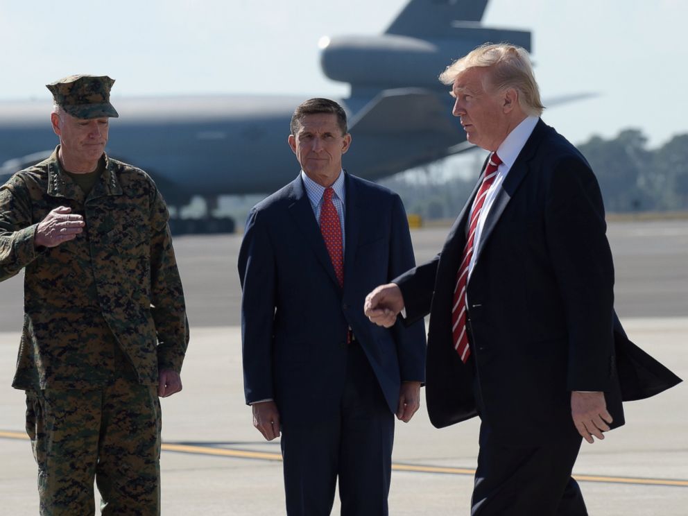 PHOTO: President Donald Trump passed Joint Chiefs Chairman Gen. Joseph Dunford, left, and National Security Adviser Michael Flynn as he arrives via Air Force One at MacDill Air Force Base in Tampa, Florida, Feb. 6, 2017.