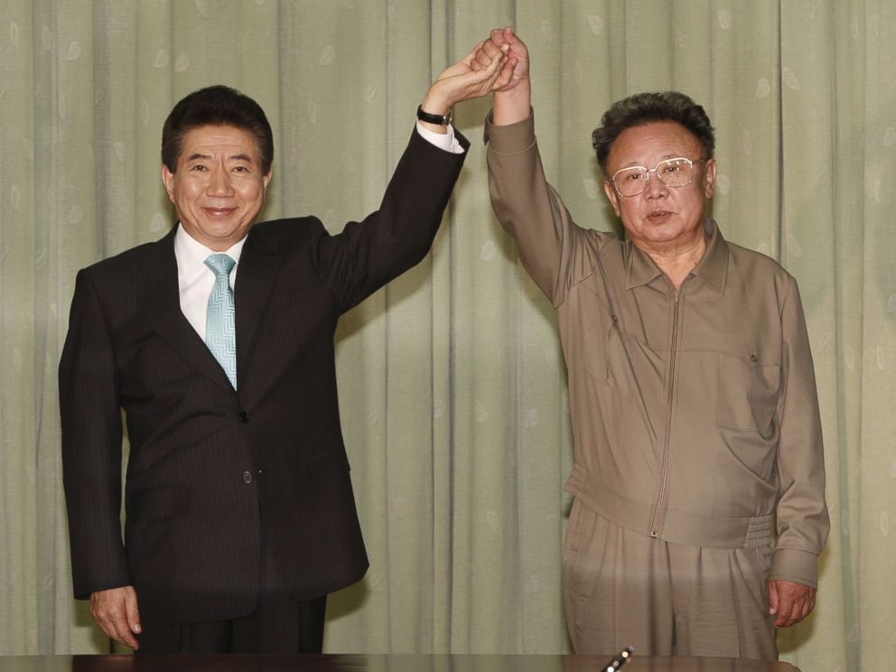 In this Oct. 4, 2007, file photo, South Korean President Roh Moo-hyun, left, holds hands with North Korean leader Kim Jong Il after exchanging joint declaration documents in Pyongyang, North Korea.