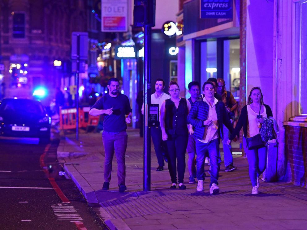 PHOTO: People run down Borough High Street as police are dealing with a "major incident" at London Bridge in London, June 3, 2017.
