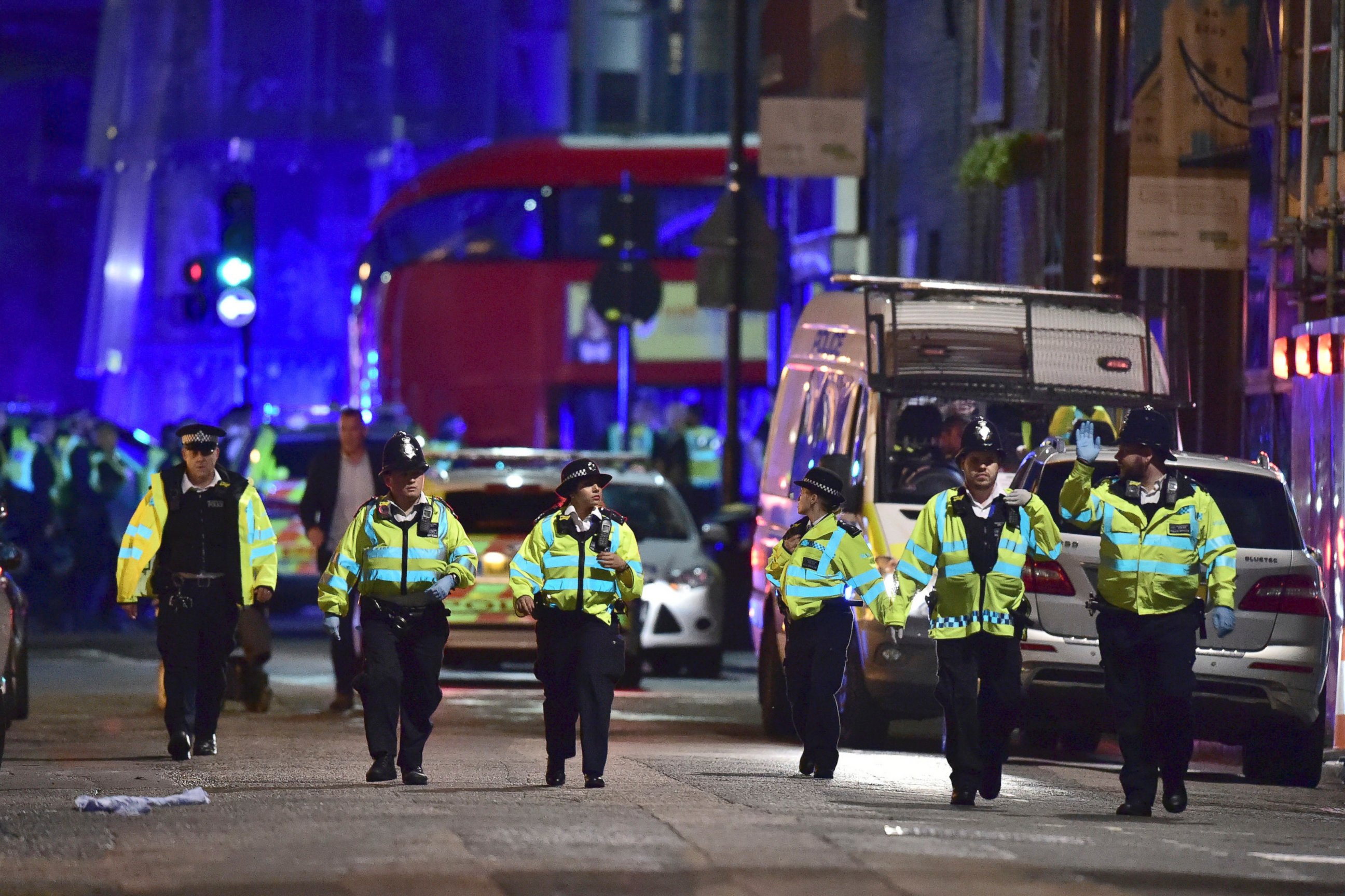 PHOTO: Police officers gather on Borough High Street as police deal with an incident on London Bridge in London, Saturday, June 3, 2017.