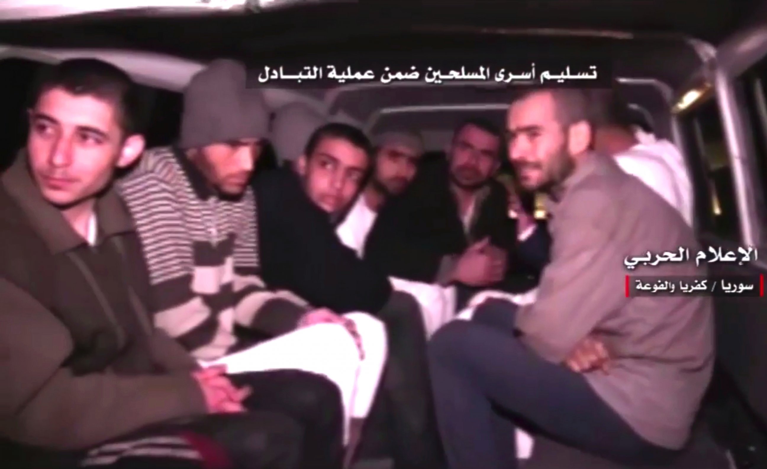 PHOTO: This frame grab shows Syrian rebels sitting inside a vehicle of the Syrian Arab Red Crescent after they were released as part of a deal to evacuate over 10,000 residents from Madaya and Zabadani in northern Syria, April 12, 2017.