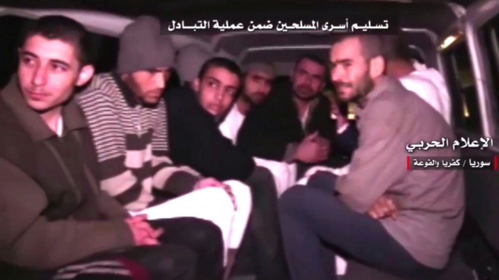 PHOTO: This frame grab shows Syrian rebels sitting inside a vehicle of the Syrian Arab Red Crescent after they were released as part of a deal to evacuate over 10,000 residents from Madaya and Zabadani in northern Syria, April 12, 2017.