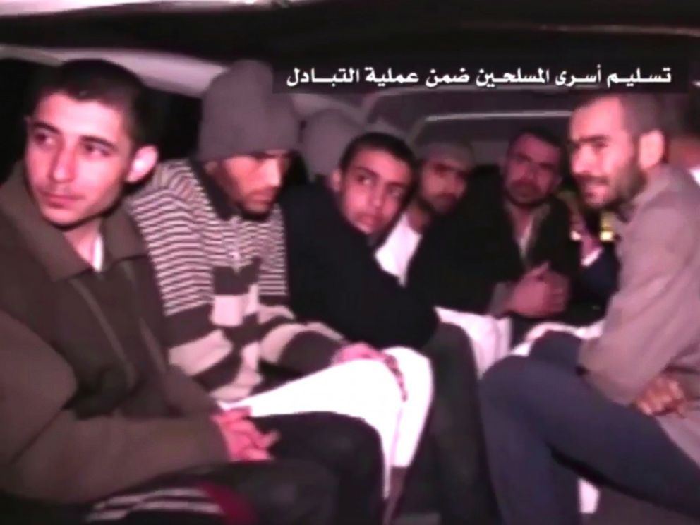 PHOTO: This frame grab shows Syrian rebels sitting inside a vehicle of the Syrian Arab Red Crescent after they were released as part of a deal to evacuate over 10,000 residents from Madaya and Zabadani in northern Syria, April 12, 2017.