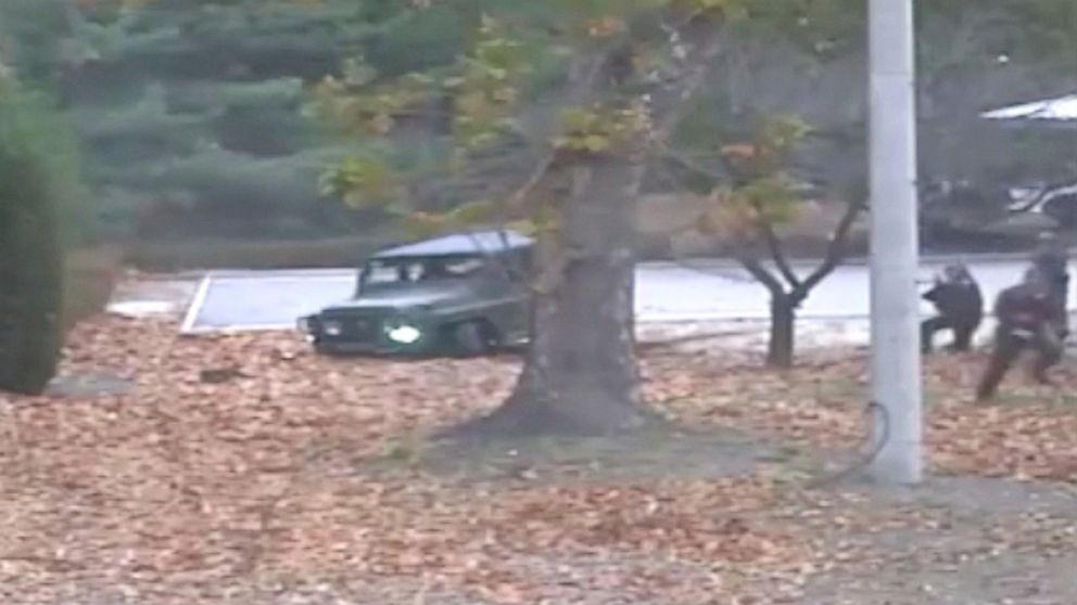 This image made from Nov. 13, 2017 surveillance video released by the United Nations Command shows a North Korean soldier running from a jeep and later shot by North Korean soldiers in Panmunjom, North Korea.