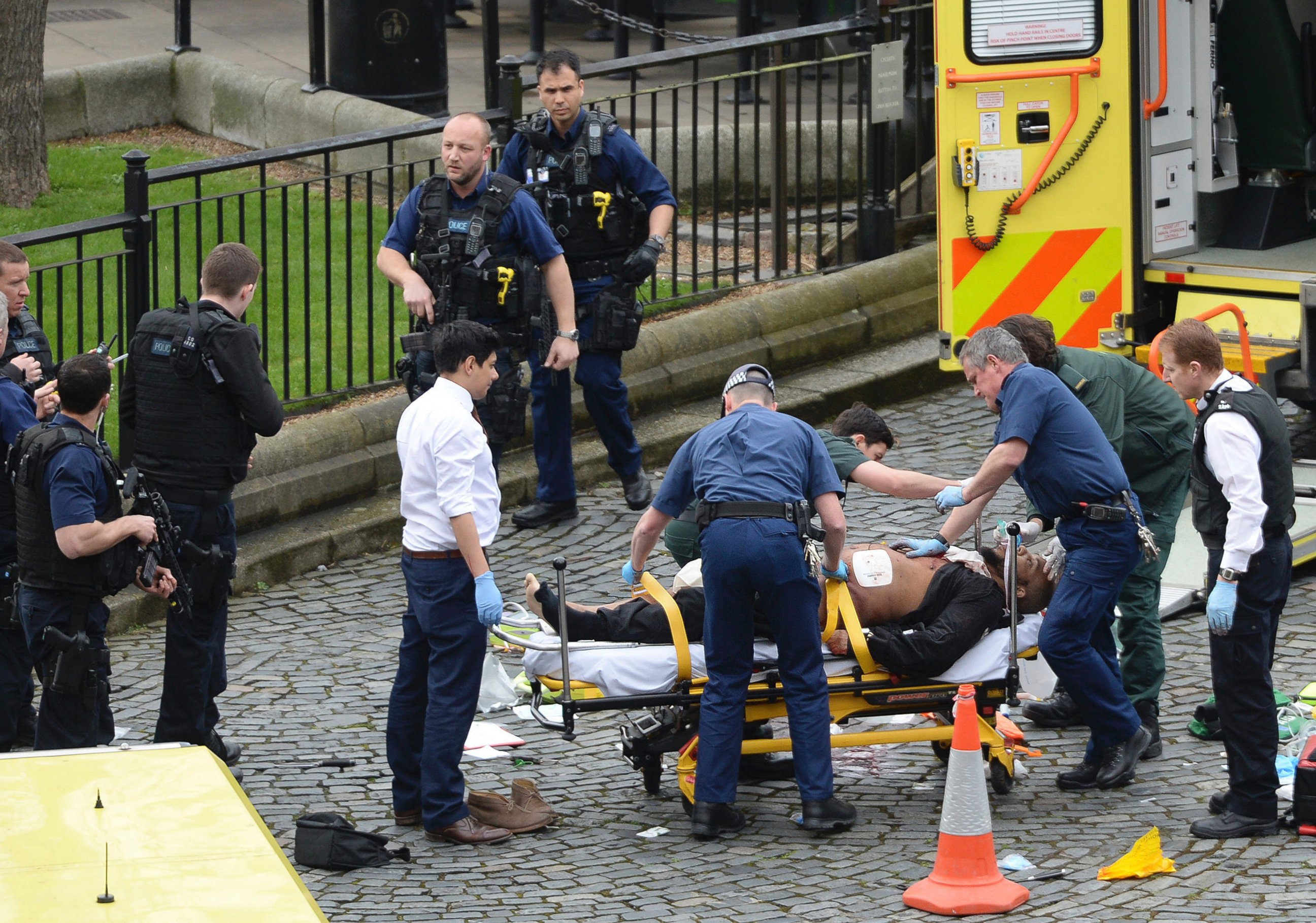 PHOTO: A man is treated by emergency services at the scene outside the Houses of Parliament London, March 22, 2017.