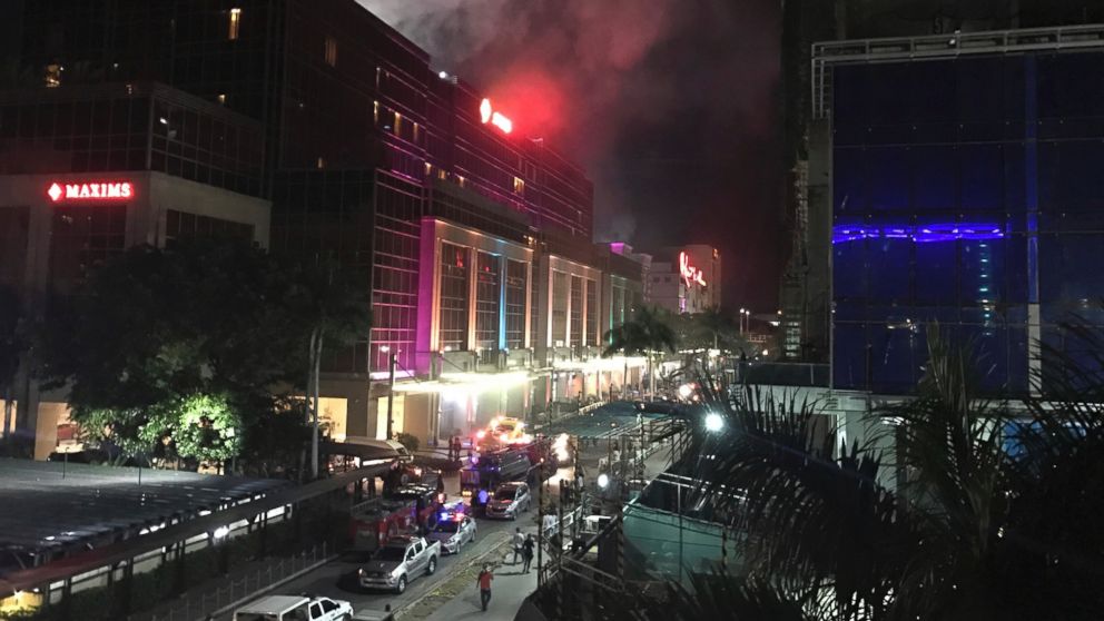 PHOTO: Smoke rises from the Resorts World Manila complex early Friday, June 2, 2017 in Manila, Philippines.