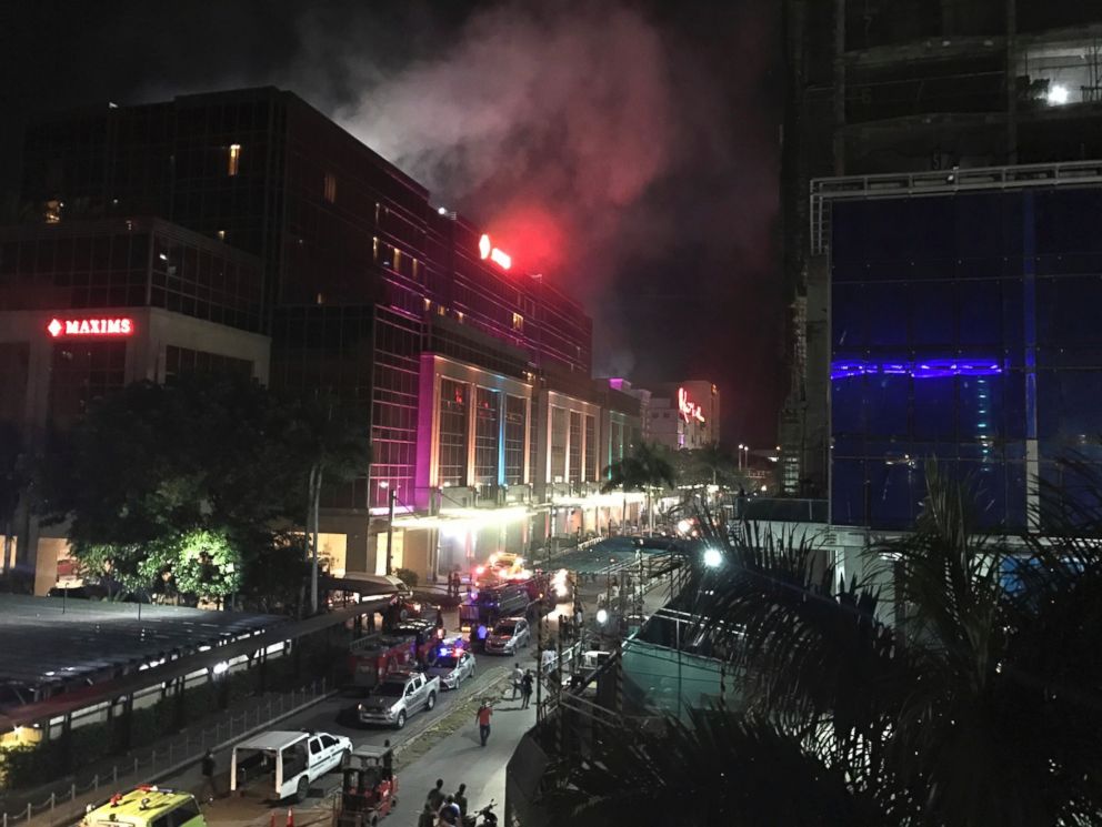 PHOTO: Smoke rises from the Resorts World Manila complex early Friday, June 2, 2017 in Manila, Philippines.