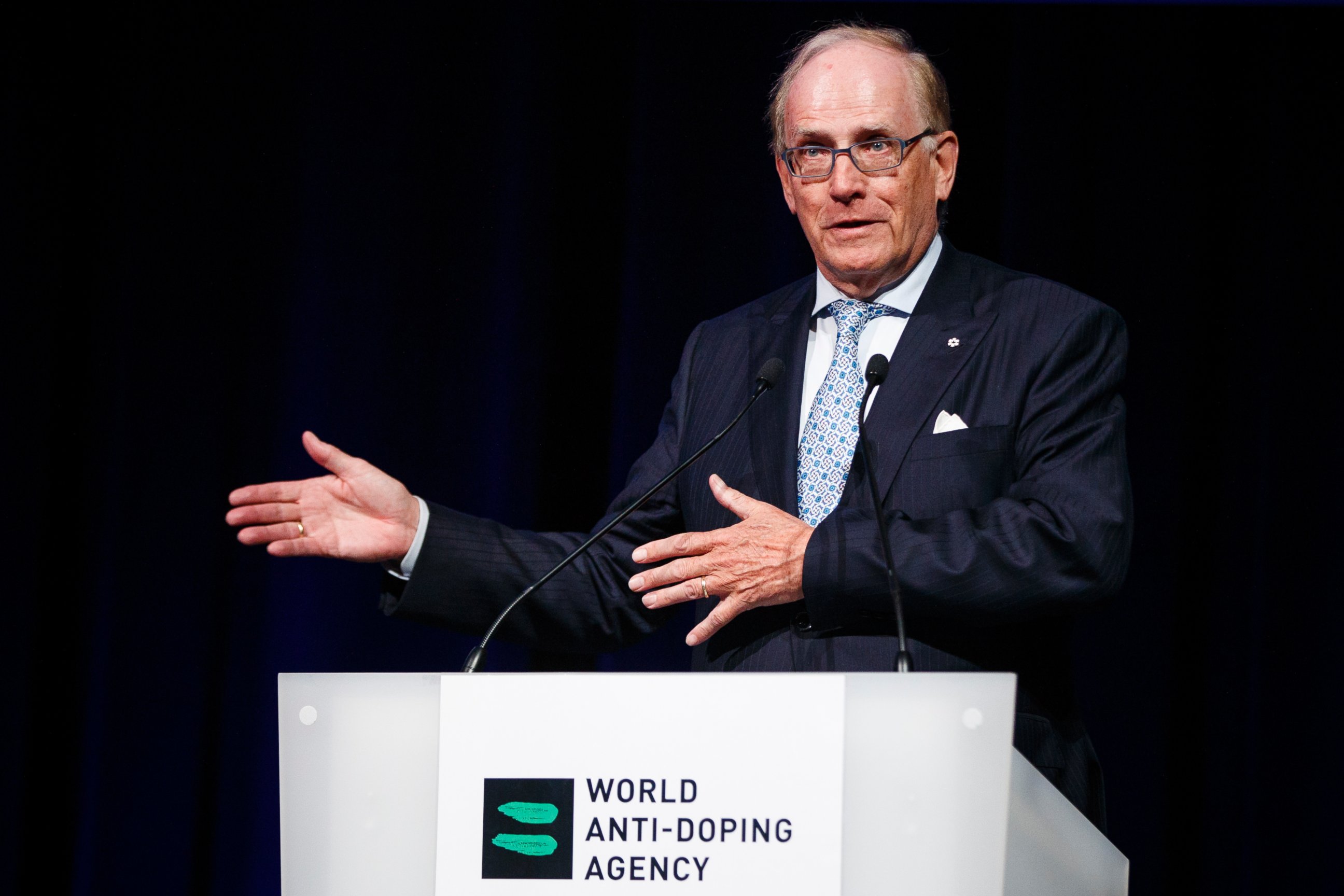 This March 13, 2017 file photo showing Richard McLaren speaking at the 2017 world anti-doping agency annual symposium in Switzerland. McLaren's work verifying systematic cheating by Russia at the 2014 Sochi Games has been vindicated by an IOC panel.