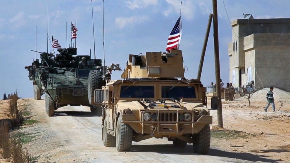 This frame grab from video provided by Arab 24 network, shows U.S. forces patrol on the outskirts of the Syrian town, Manbij, March 7, 2017.