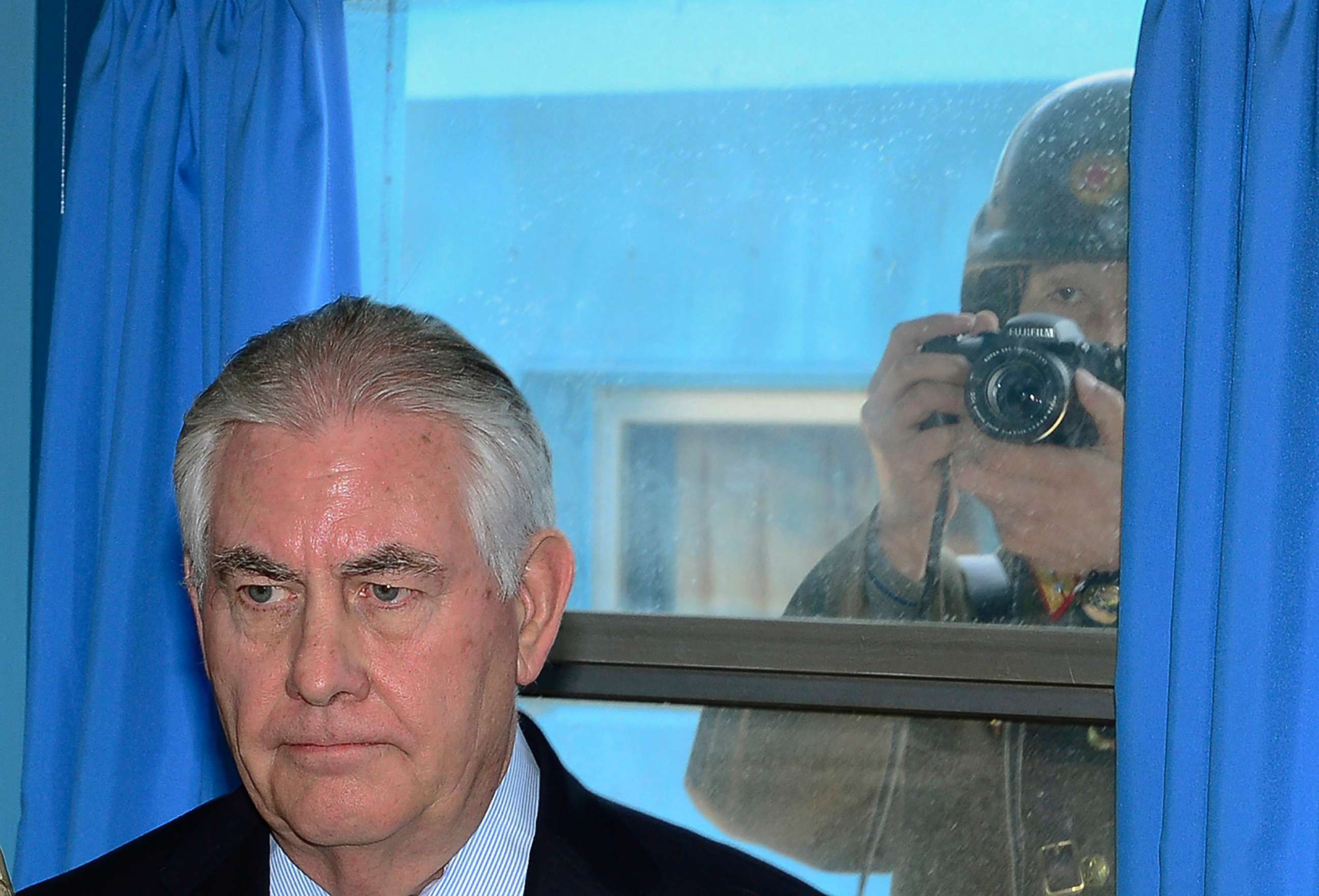 PHOTO: A North Korean soldier tries to take a photograph through a window while Secretary of State Rex Tillerson visits the U.N. Command Military Armistice Commission meeting room at the border village of Panmunjom, South Korea, March 17, 2017.
