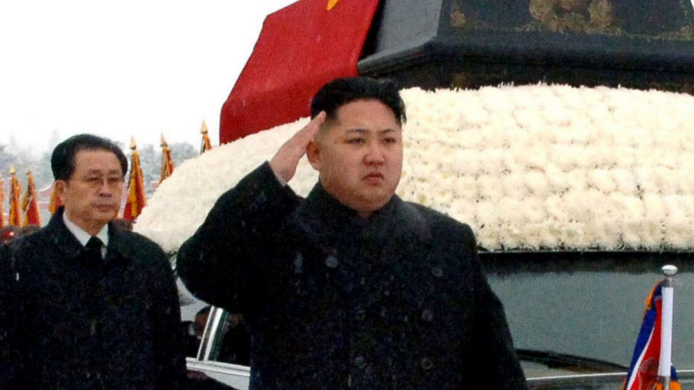In this Dec. 28, 2011 file photo, North Korea's leader, Kim Jong Un, front center, is followed by his uncle Jang Song Thaek, vice chairman of the National Defense Commission, as he salutes beside the hearse carrying the body of his late father North Korean leader Kim Jong Il.