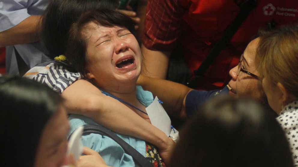PHOTO: Relatives of passengers of the missing AirAsia flight QZ 8501 react to the news about the findings of bodies in the waters near the site where the jetliner disappeared, at Juanda International Airport in Surabaya, Indonesia, Dec. 30, 2014.