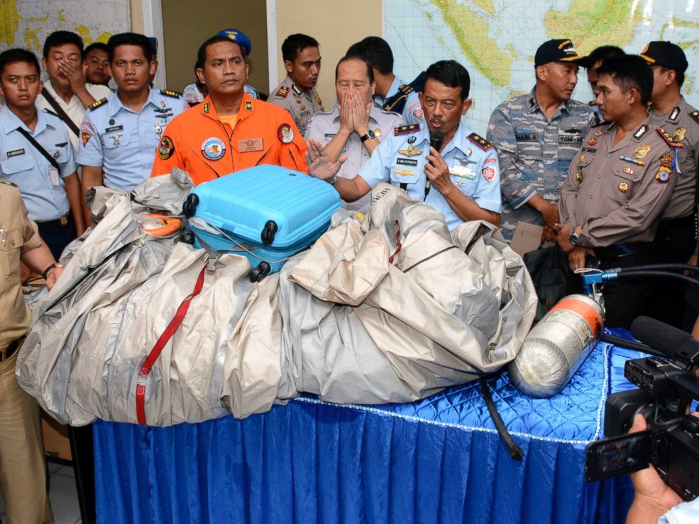 PHOTO: Indonesian Air Force officials show AirAsia Flight 8501 debris during a press conference at the airbase in Pangkalan Bun, Central Borneo, Indonesia, Dec. 30, 2014.