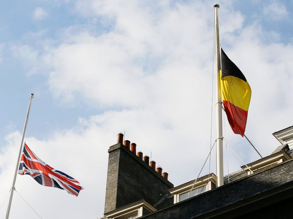 PHOTO: The Belgium and British flag fly at half staff above Downing Street in London, following the attacks in Brussels, March, 22, 2016.