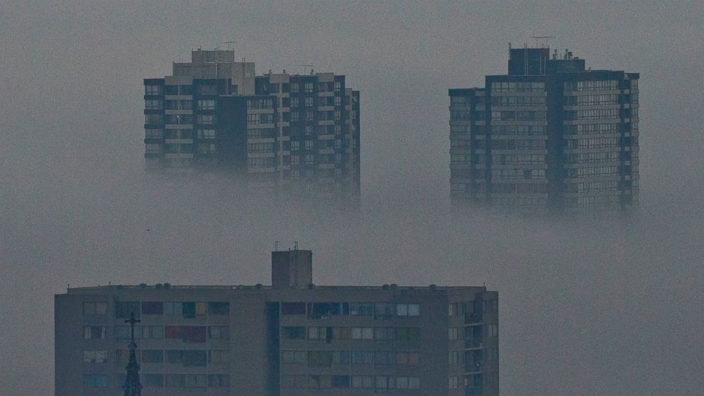 Buildings are engulfed in clouds of pollution in Santiago, Chile, Tuesday, June 21, 2016.