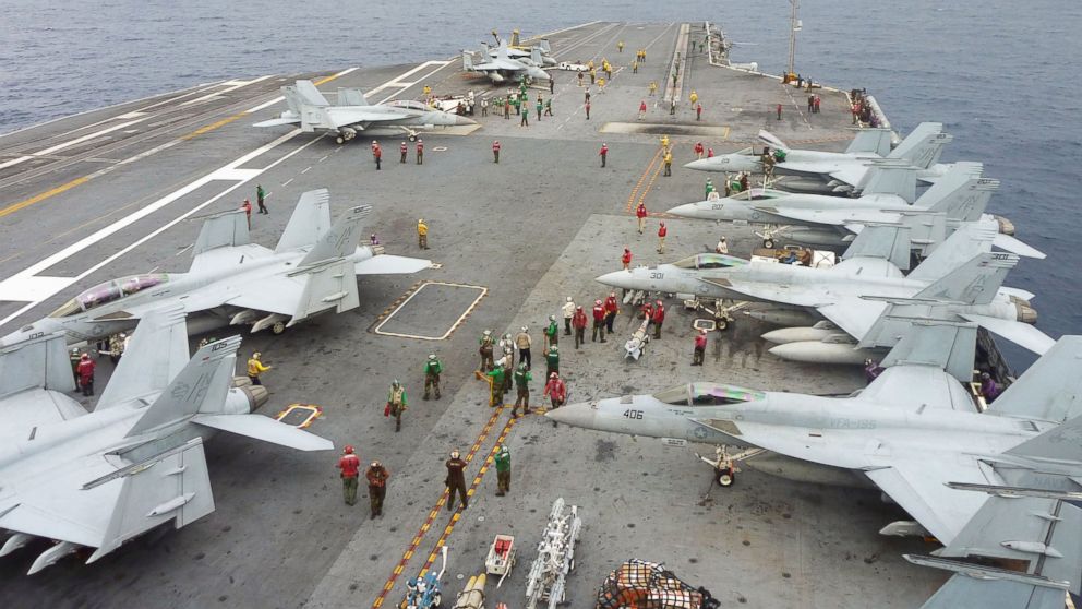 PHOTO: U.S. Navy FA-18 Hornets cram the flight deck of the USS George Washington during a joint military exercise with Japan in the Pacific Ocean near Okinawa on Nov. 28, 2013. 