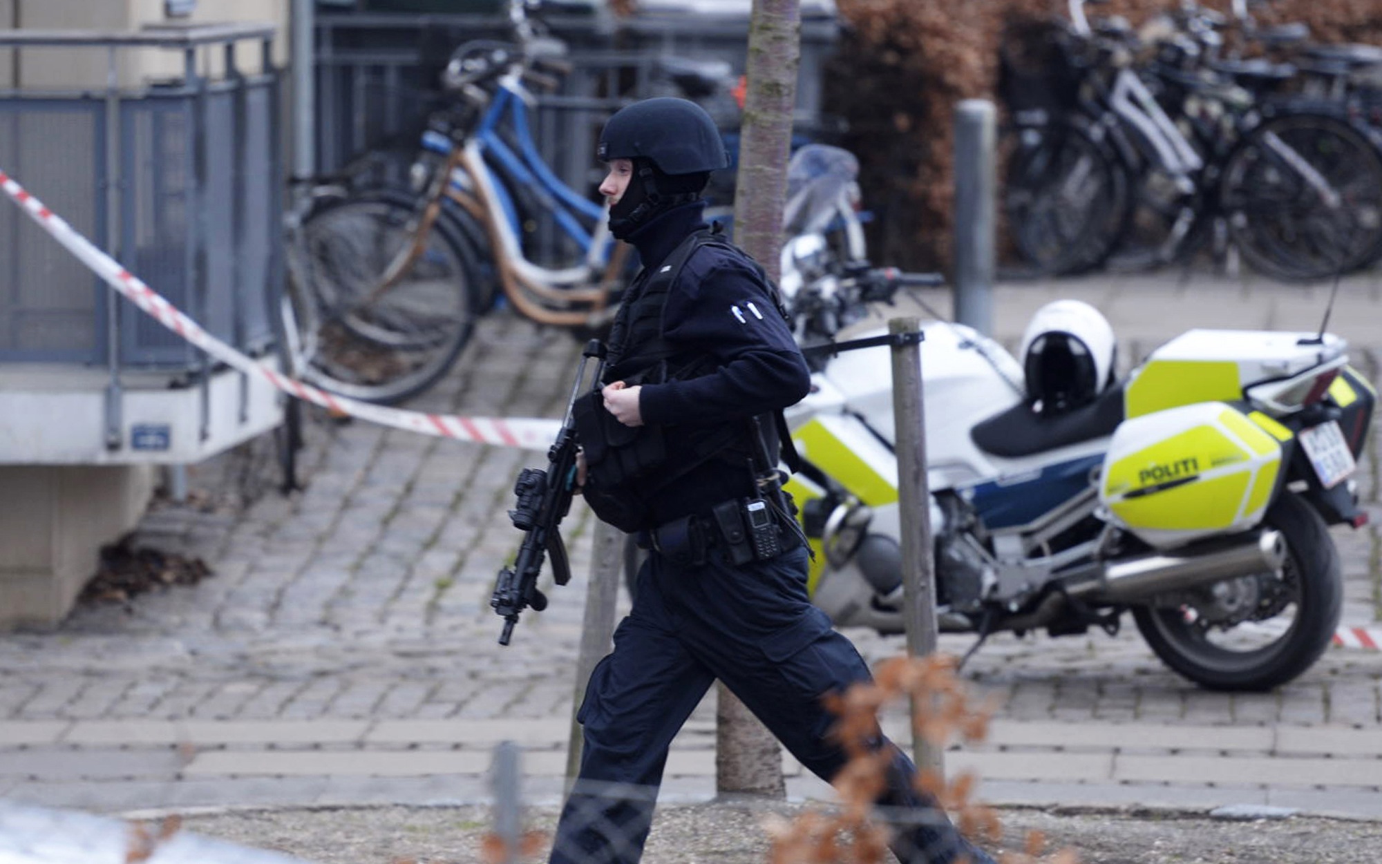 PHOTO: An armed security officer runs down a street near a venue after shots were fired where an event titled  "Art, blasphemy and the freedom of expression" was being held in Copenhagen, Saturday, Feb. 14, 2015.