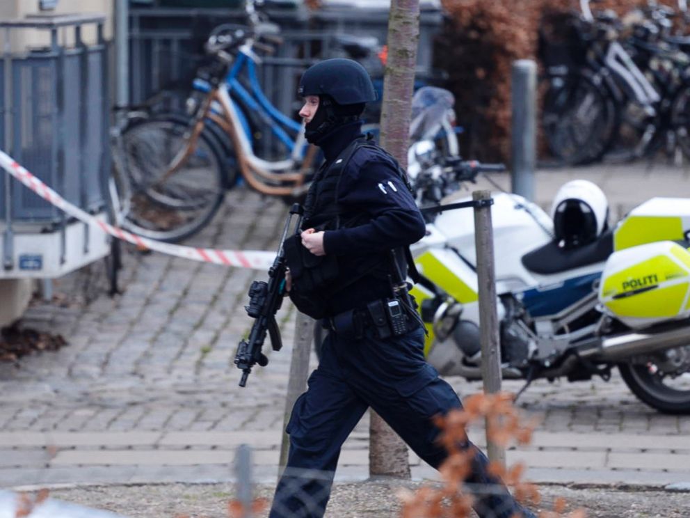 PHOTO: An armed security officer runs down a street near a venue after shots were fired where an event titled Art, blasphemy and the freedom of expression was being held in Copenhagen, Saturday, Feb. 14, 2015.