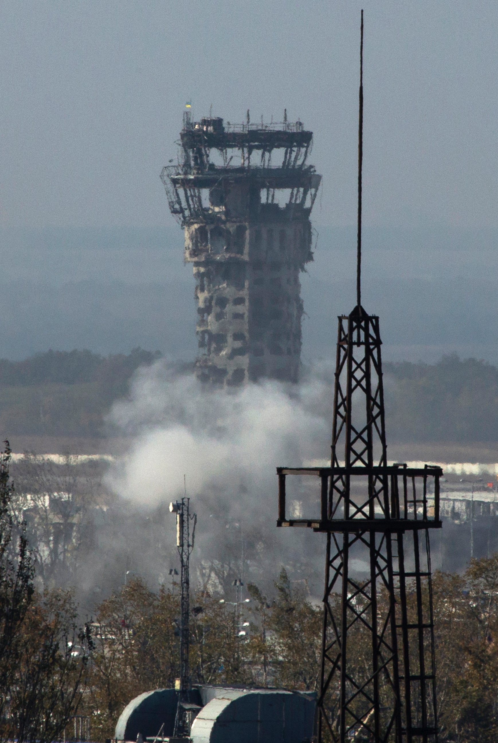 PHOTO: Smoke rises near the traffic control tower of Donetsk Sergey Prokofiev International Airport during artillery battle between pro-Russian rebels and Ukrainian government forces in the town of Donetsk, eastern Ukraine, Oct. 8, 2014. 