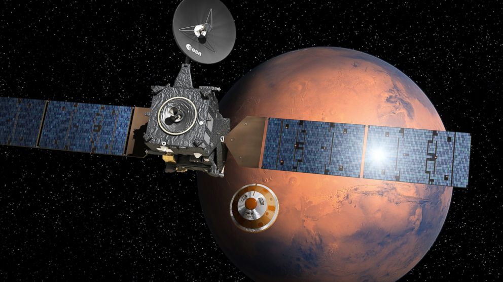 An artist's depiction provided by the European Space Agency shows the separation of the ExoMars landing module from the Trace Gas Orbiter above Mars.