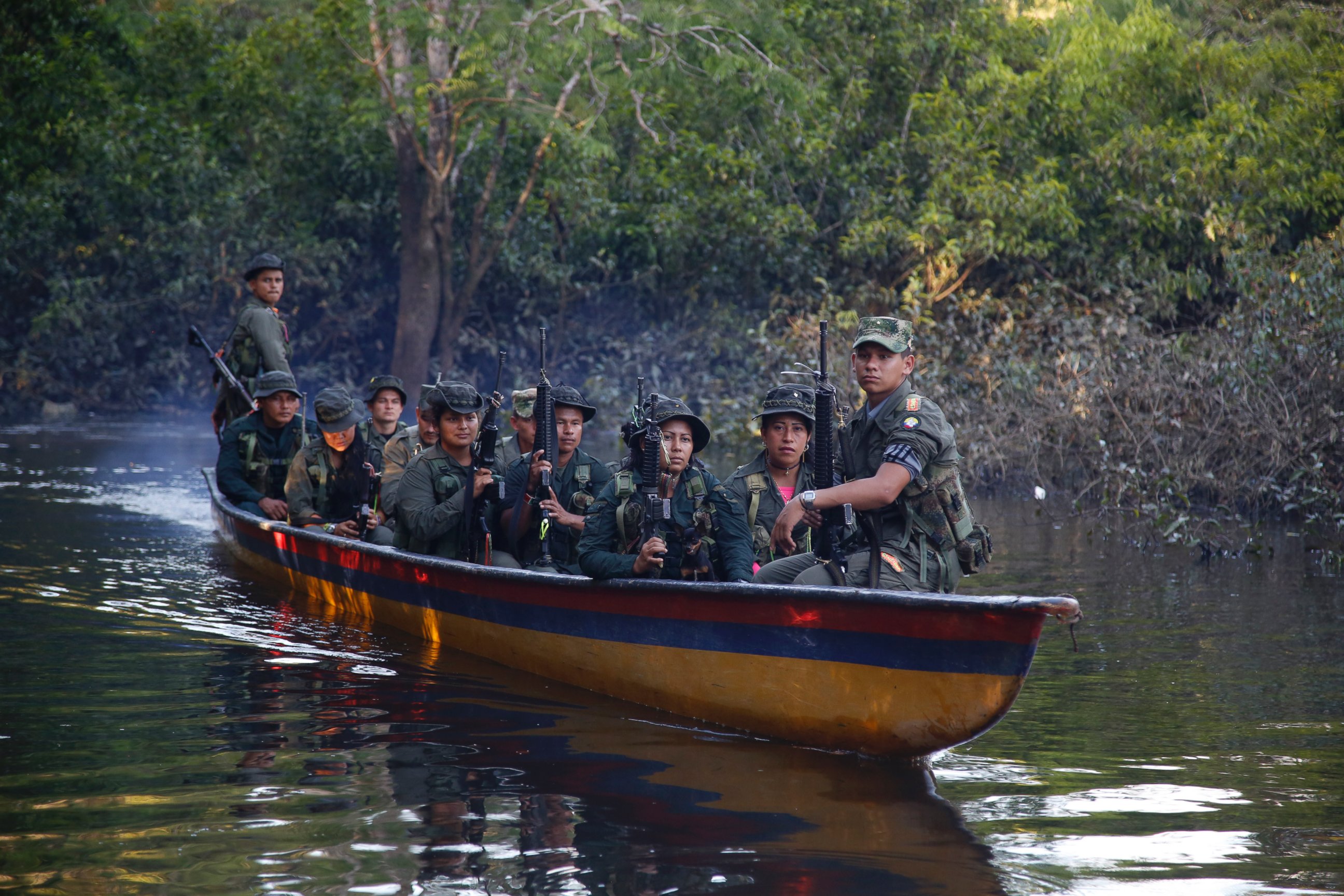 PHOTO: FARC rebels of the 32nd Front of the Revolutionary Armed Forces of Colombia, or FARC, sit in a boat as they patrol the Mecaya river in the southern jungles of Putumayo, Colombia, Aug. 11, 2016.