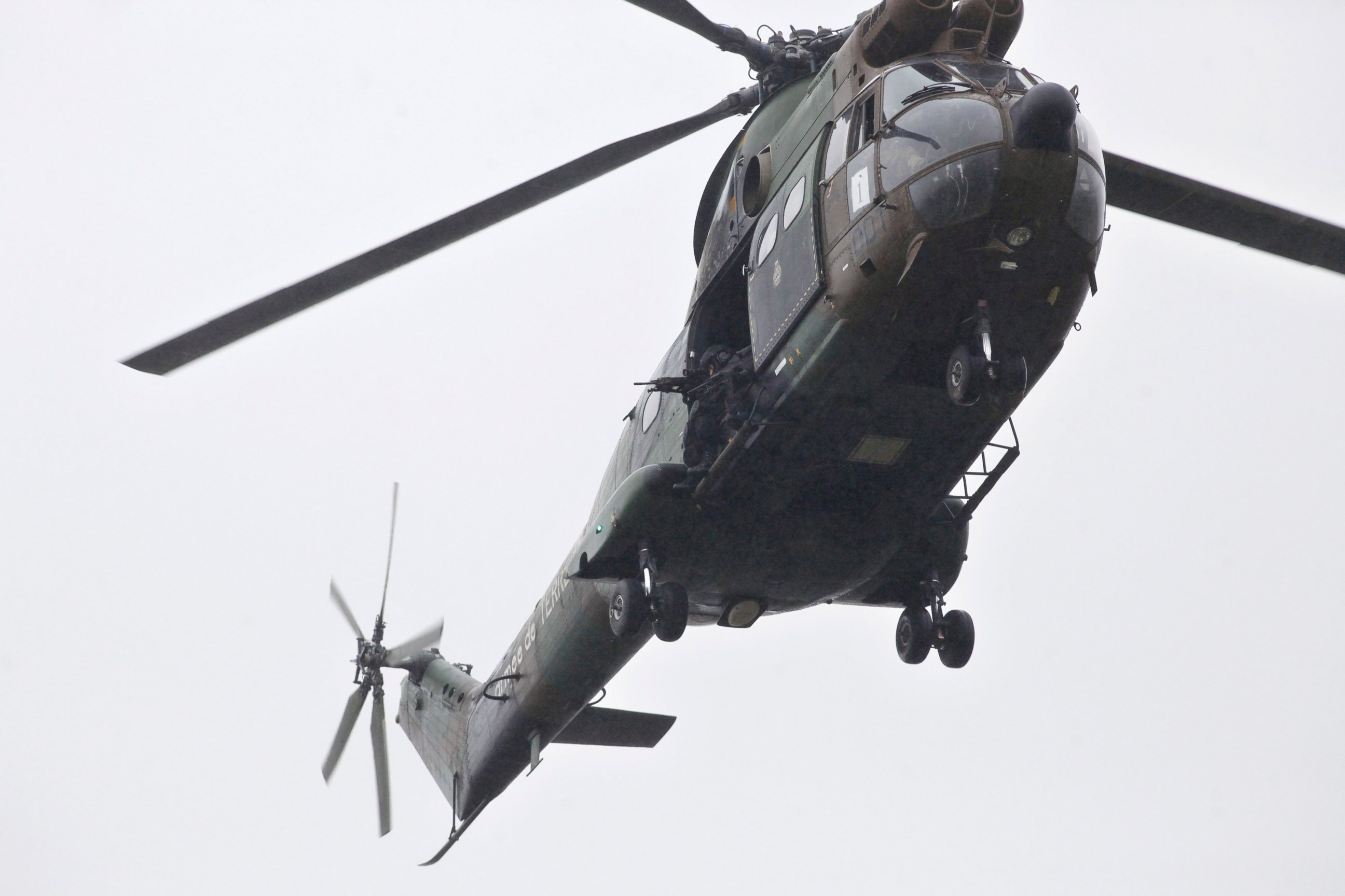 PHOTO: Armed French security forces fly over the location where two heavily armed suspects, believed to have taken part in the Charlie Hebdo shootings, are located in Dammartin-en-Goele, northeast of Paris, Jan. 9, 2015. 