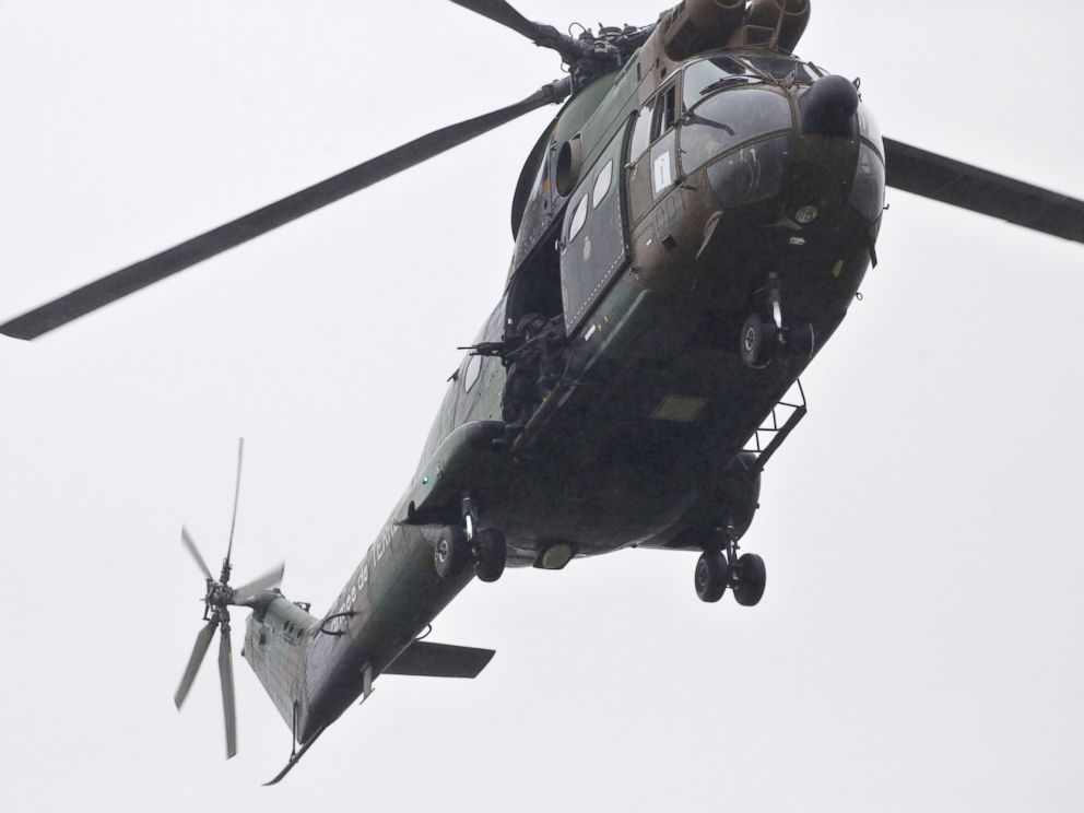 PHOTO: Armed French security forces fly over the location where two heavily armed suspects, believed to have taken part in the Charlie Hebdo shootings, are located in Dammartin-en-Goele, northeast of Paris, Jan. 9, 2015.