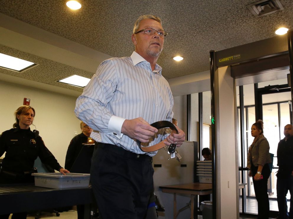 PHOTO: Fred Couch, father of affluenza teen Ethan Couch, collects his belt after clearing security as he arrives at juvenile court, Feb. 5, 2014, in Fort Worth, Texas.
