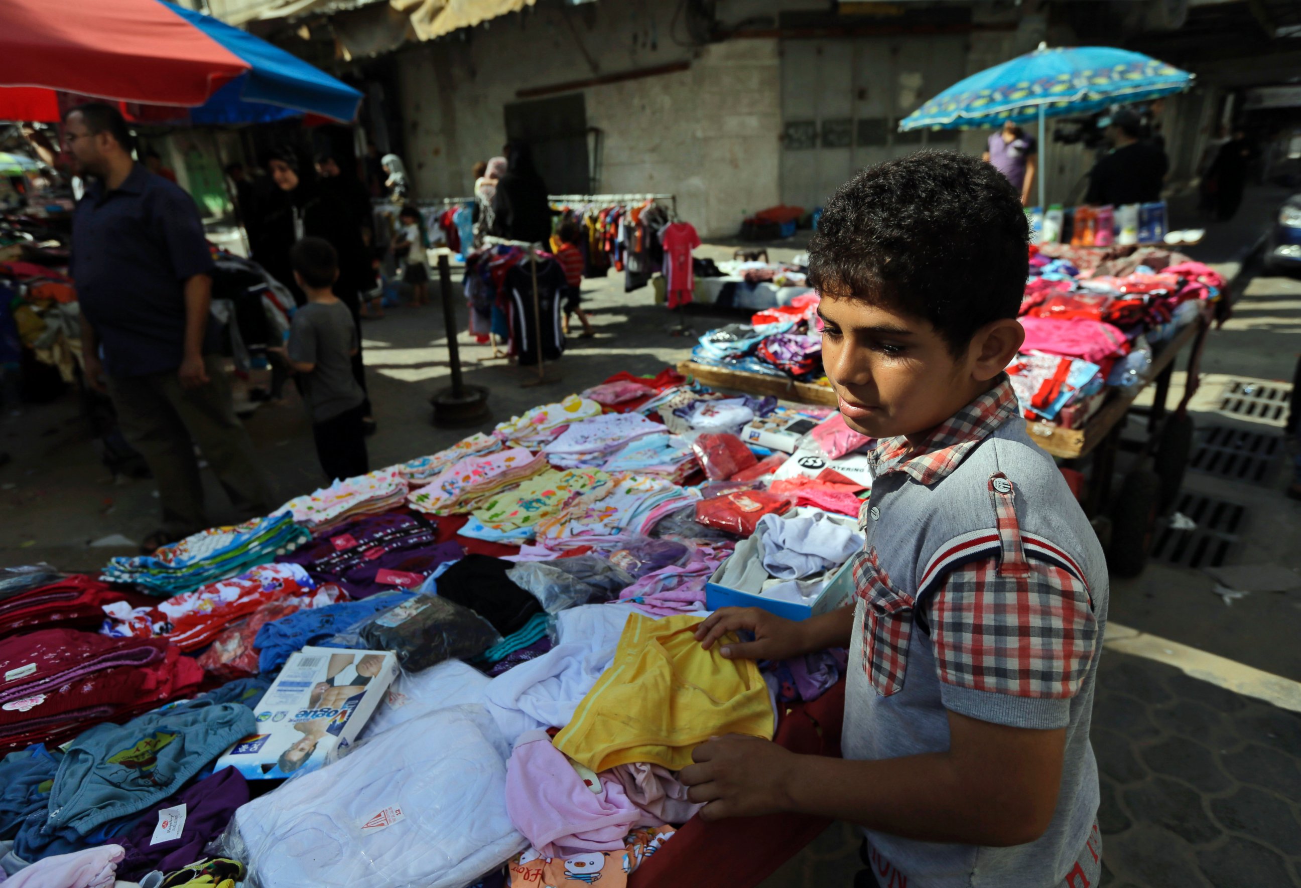 PHOTO: A Palestinian vendor arranges his merchandise at a market in Gaza City, northern Gaza Strip, Aug. 6, 2014. 