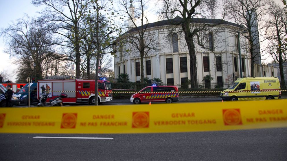 Police and fire personnel respond outside the Grand Mosque of Brussels, Nov. 26, 2015.