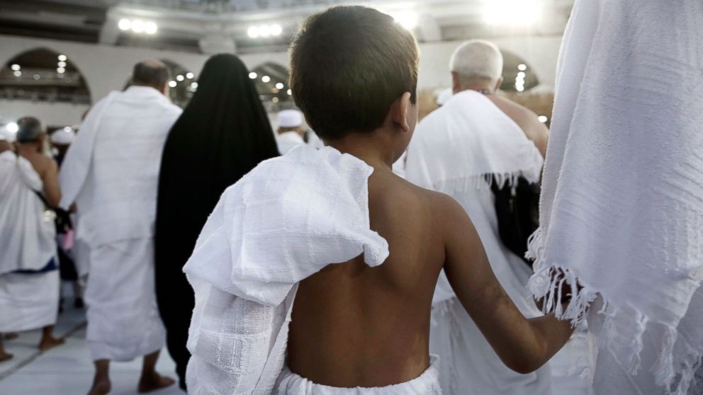 A child holds on to his father as he circles the Kaaba, Islam's holiest shrine, at the Grand Mosque in the Muslim holy city of Mecca, Saudi Arabia, Sept. 8, 2016. Hundreds of thousands of Muslims have arrived in the kingdom to participate in the annual hajj pilgrimage, which starts Saturday, a ritual required of all able-bodied Muslims at least once in their life.
