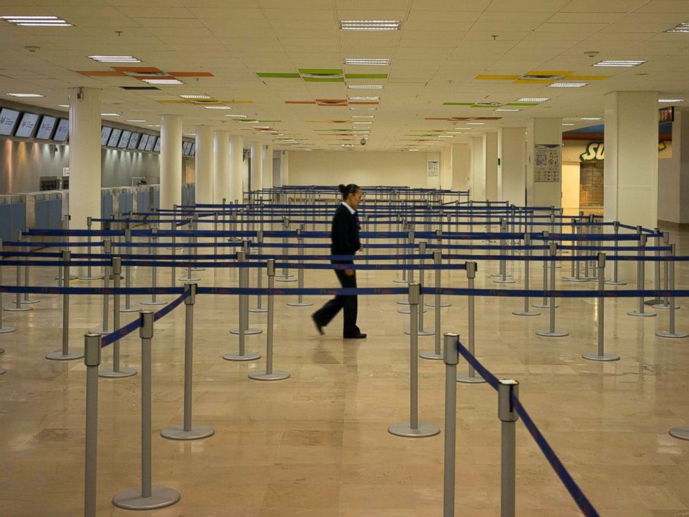 PHOTO: An airline employee walks through an empty airport where all flights are cancelled as Hurricane Patricia approaches the Pacific resort city Puerto Vallarta, Mexico, Oct. 23, 2015.