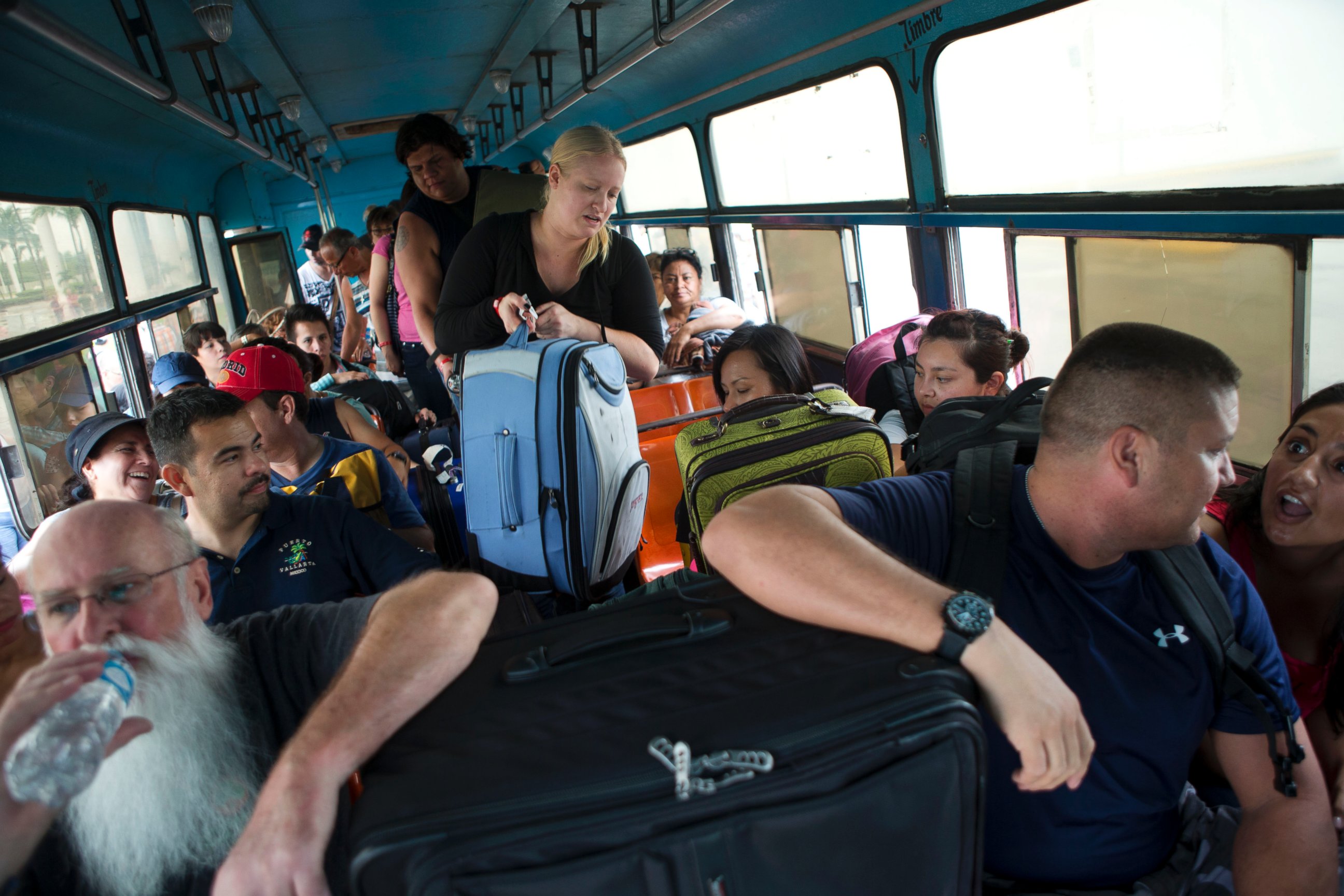 PHOTO: Mexican and international tourists board a bus to be transported to a shelter, bracing for the arrival of Hurricane Patricia in Puerto Vallarta, Mexico, Oct. 23, 2015.
