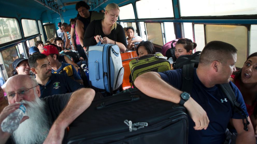 PHOTO: Mexican and international tourists board a bus to be transported to a shelter, bracing for the arrival of Hurricane Patricia in Puerto Vallarta, Mexico, Oct. 23, 2015.