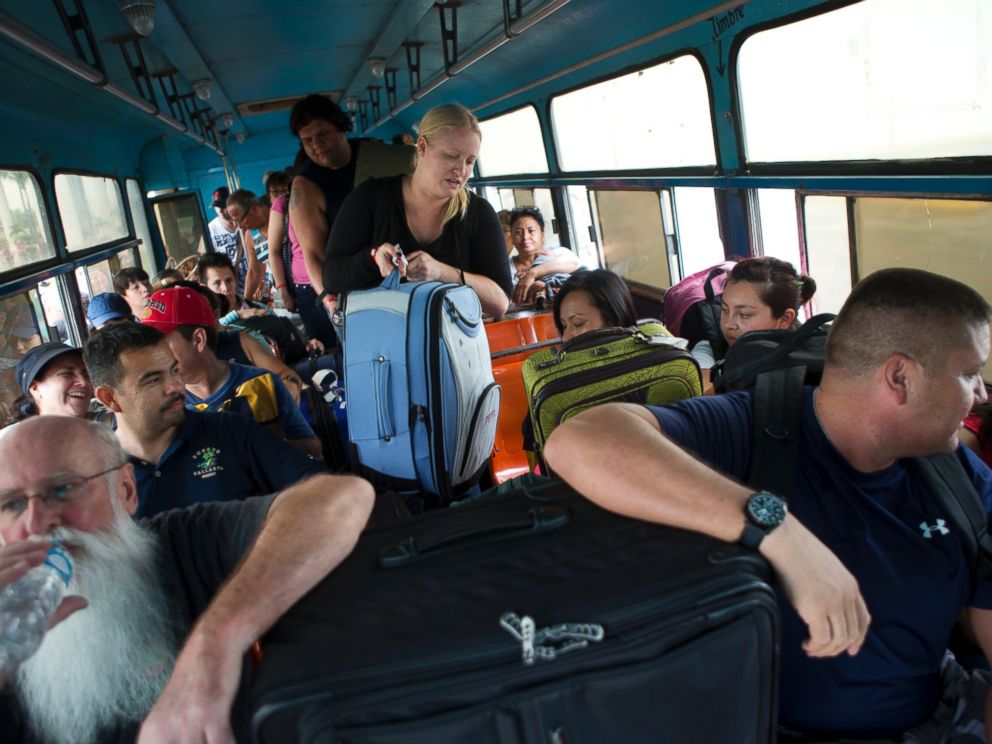 PHOTO: Mexican and international tourists board a bus to be transported to a shelter, bracing for the arrival of Hurricane Patricia in Puerto Vallarta, Mexico, Oct. 23, 2015.