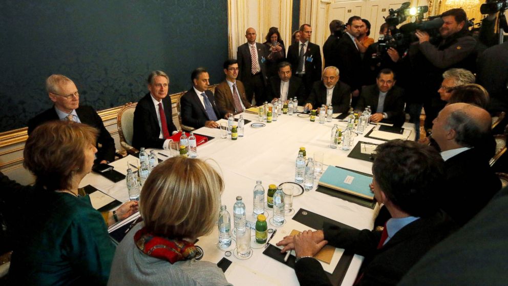 Former EU foreign policy chief Catherine Ashton, left, British Foreign Secretary Philip Hammond, third left, Iranian Foreign Minister Mohammad Javad Zarif, rear center, and French Foreign Minister Laurent Fabius, second right, wait for the start of closed-door nuclear talks with Iran in Vienna, Nov. 21, 2014.
