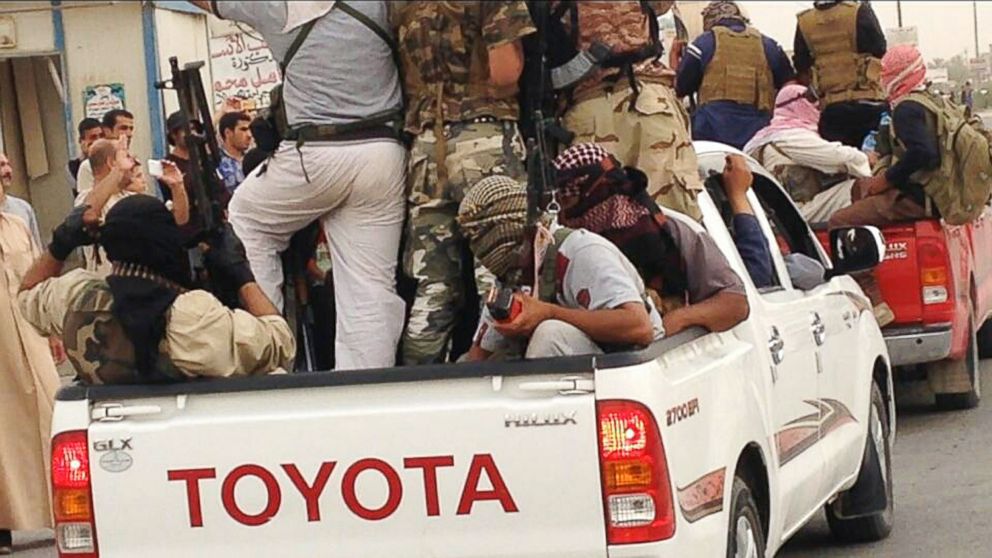 PHOTO: In this  July 29, 2014 photo, Islamic militants parade in Beiji, Iraq. 
