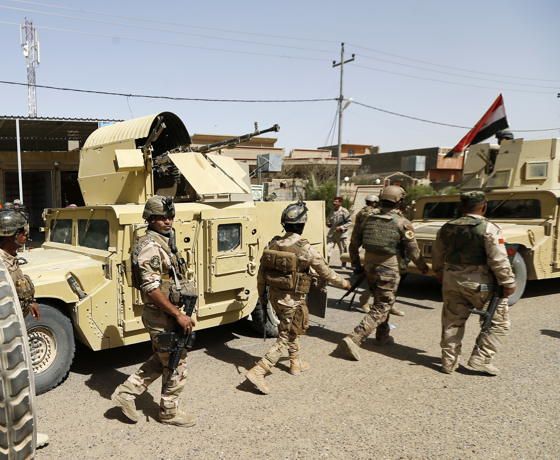 PHOTO: Iraqi security forces enter central Fallujah after fight against the Islamic State militants, Iraq, June 17, 2016.