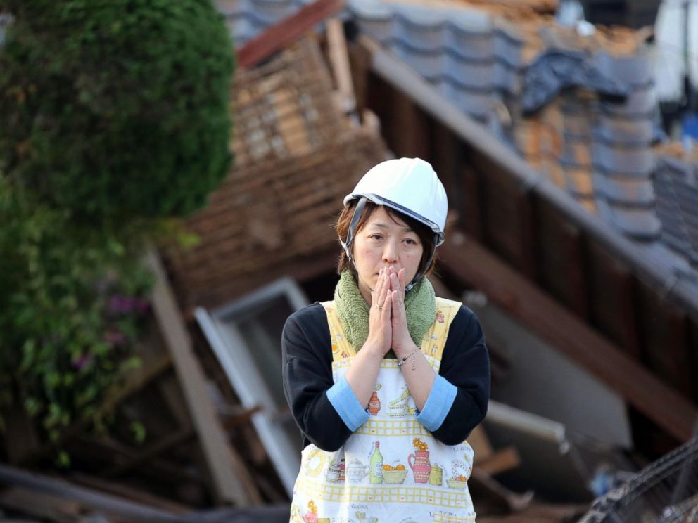 PHOTO: A resident stands in front of damaged house in Mashiki, Kumamoto prefecture, southern Japan, April 16, 2016.