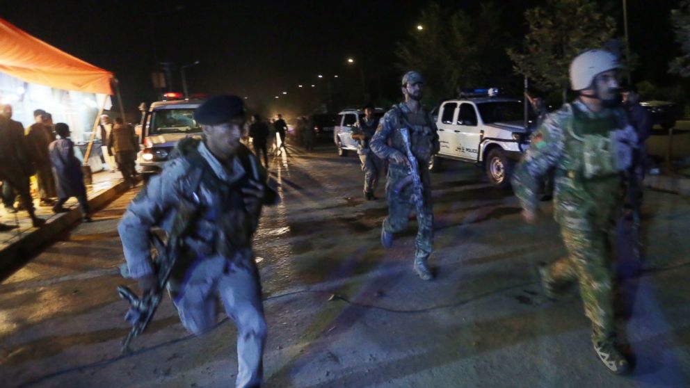 Afghan security forces rush to respond to reports of an attack on the campus of the American University in the Afghan capital Kabul on Aug. 24, 2016.