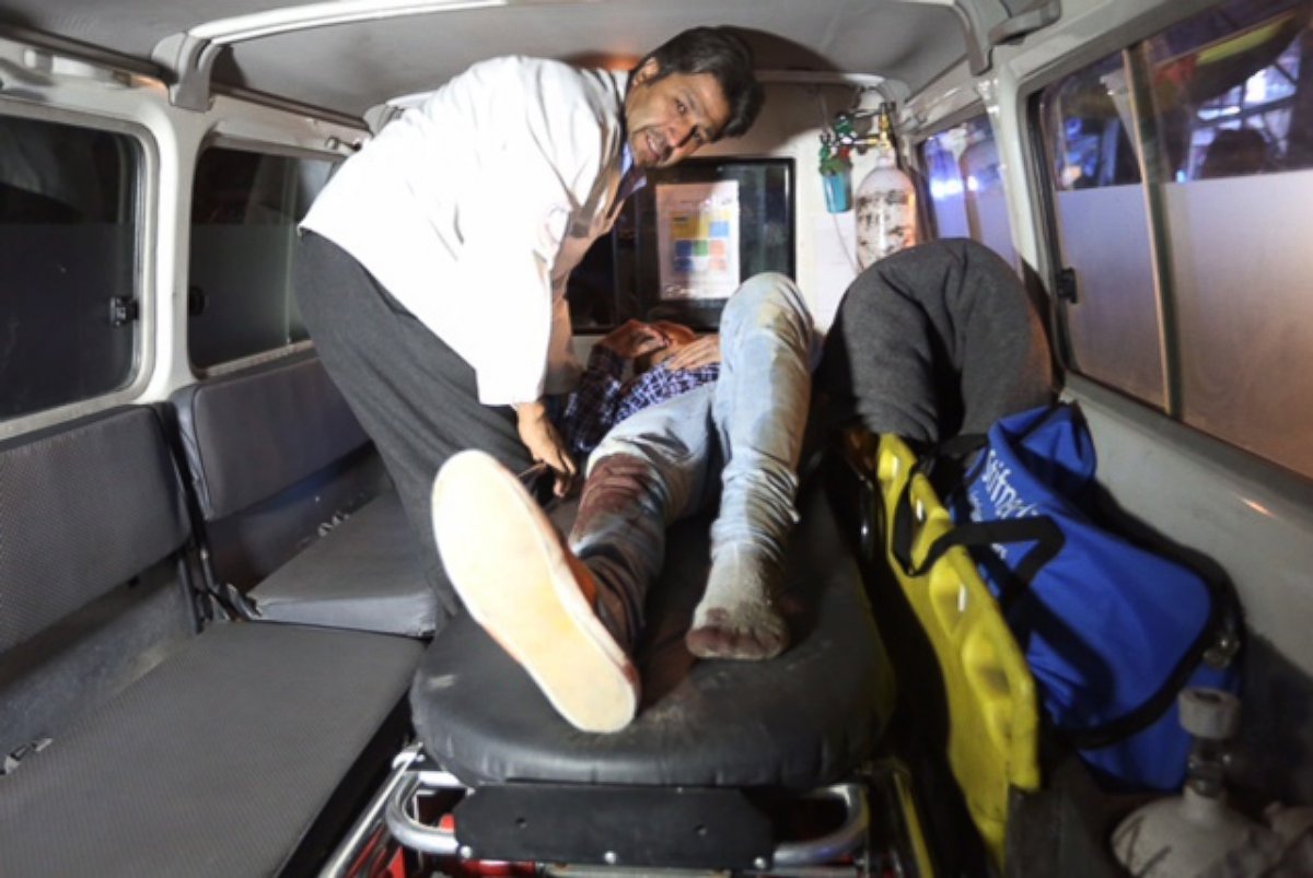 PHOTO: A wounded person is treated in an ambulance after an attack on the campus of the American University in the Afghan capital Kabul on Aug. 24, 2016.