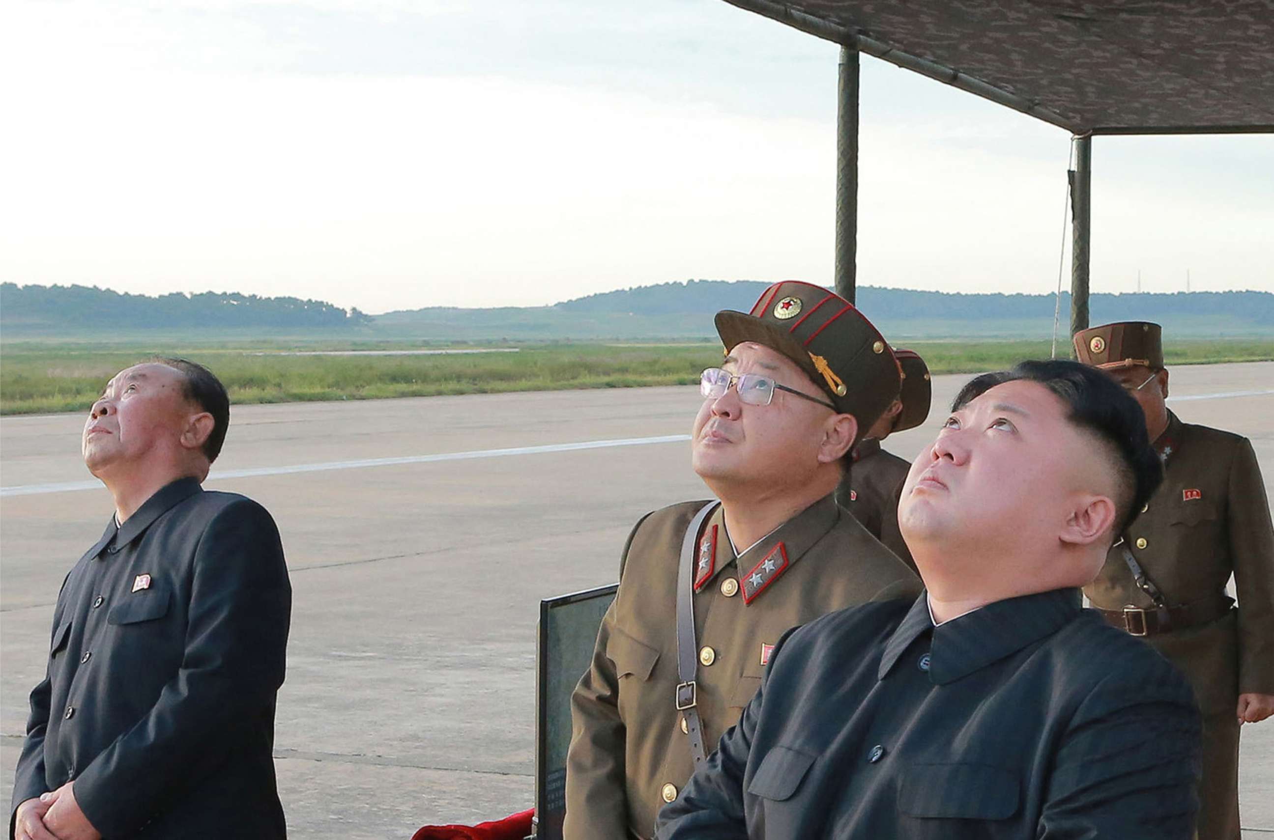 PHOTO: In this undated photo distributed on Sept. 16, 2017, by the North Korean government, leader Kim Jong Un, right, watches what was said to be the test launch of an intermediate range Hwasong-12 missile at an undisclosed location in North Korea.