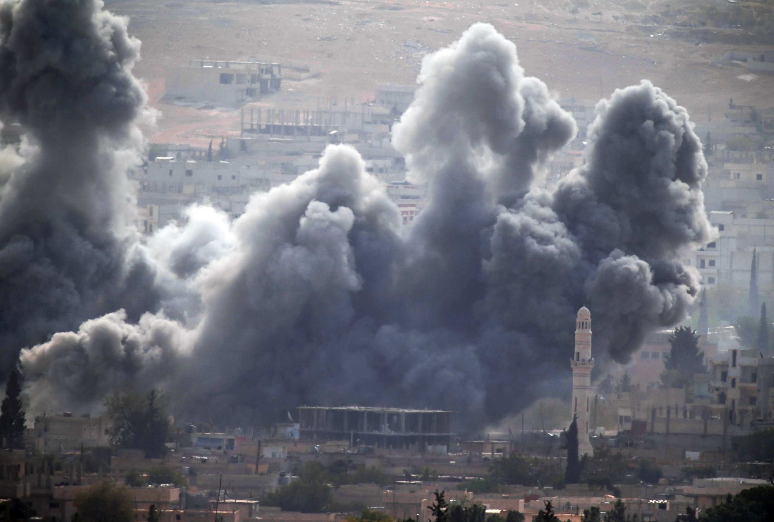 PHOTO: Thick smoke rises following an airstrike by the US-led coalition in Kobani, Syria as fighting continued between Syrian Kurds and the militants of Islamic State group, as seen from Mursitpinar Turkey-Syria border, Oct. 13, 2014. 