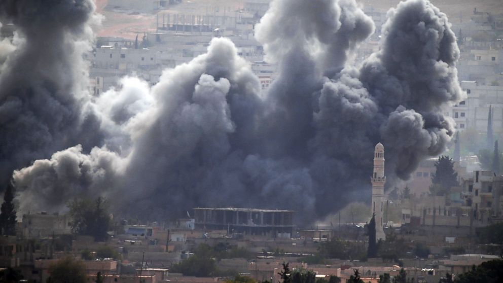 Thick smoke rises following an airstrike by the US-led coalition in Kobani, Syria as fighting continued between Syrian Kurds and the militants of Islamic State group, as seen from Mursitpinar Turkey-Syria border, Oct. 13, 2014. 